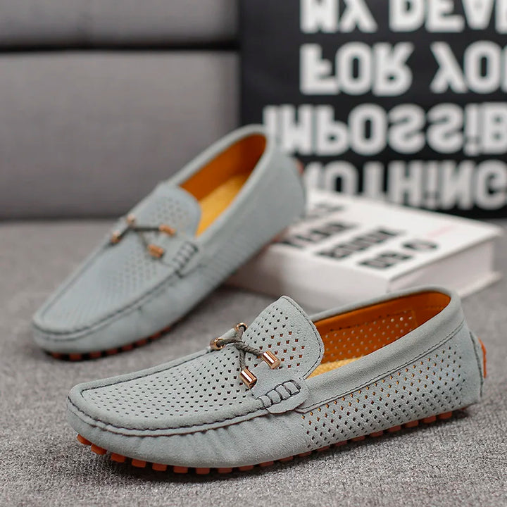 Breathable men's perforated leather slip-on shoes, ideal for comfort and style.