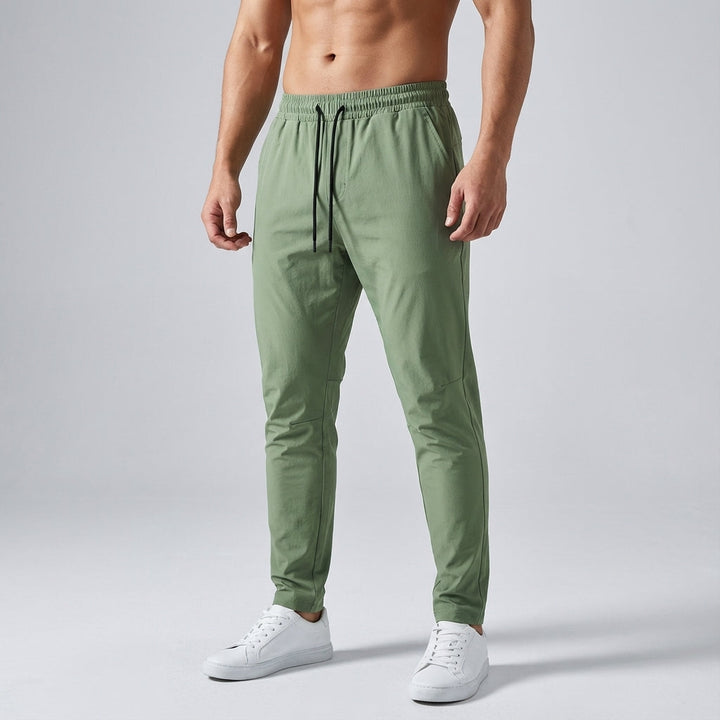 Men's sportswear trousers with adjustable drawstring waist, versatile athletic pants.