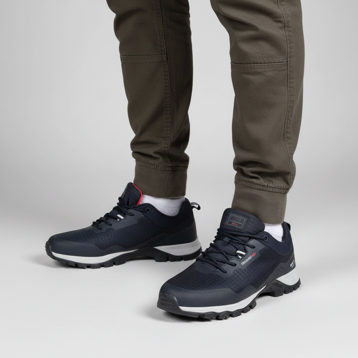 Close-up of men's waterproof trail sneakers showing breathable mesh upper and rugged non-slip sole