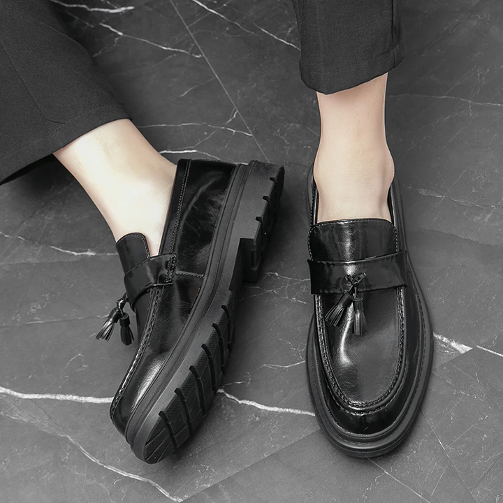 Close-up of the tassels on Belmont Loafers, adding elegance to these mens slip-on shoes.