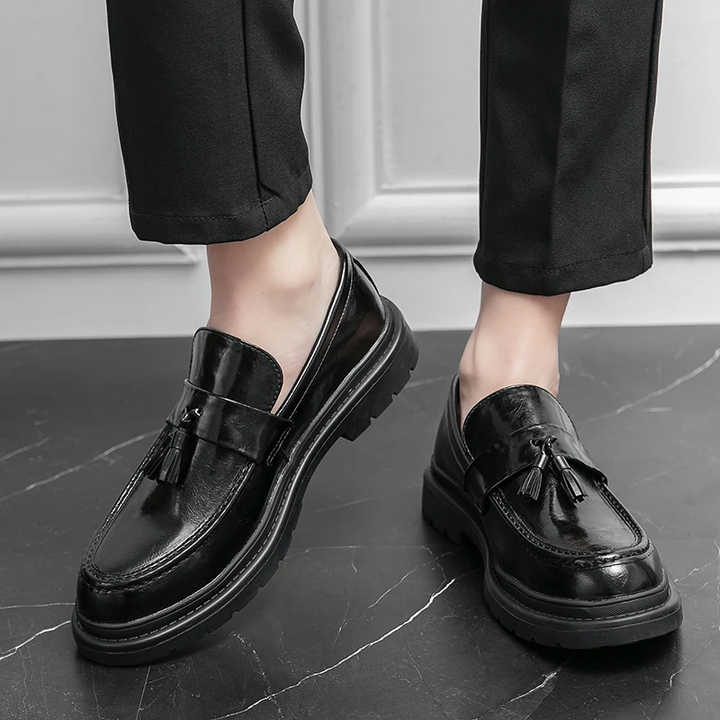 Men's comfortable black Belmont Tassel Loafers, durable lug sole for all-day wear.