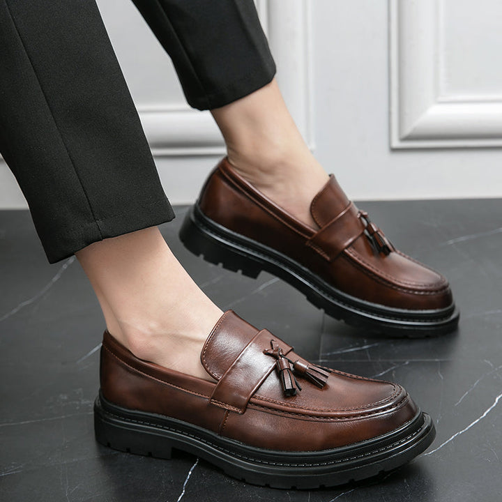 Black Belmont Tassel Loafers for men, stylish slip-on dress shoes with a comfortable lug sole.