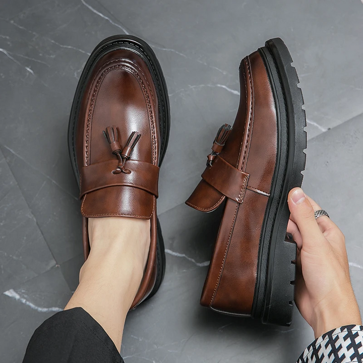Elegant mens black dress loafers, Belmont Tassel, offering a sophisticated slip-on style.