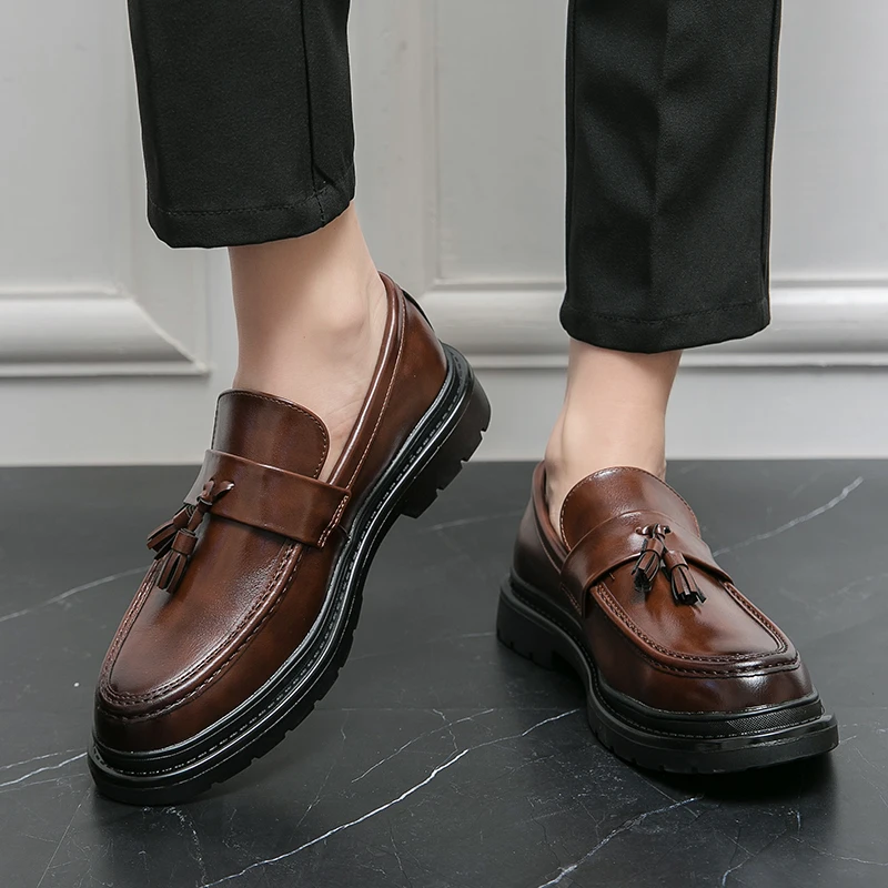 Classic mens black tassel loafers, Belmont design, a timeless slip-on shoe for any occasion.