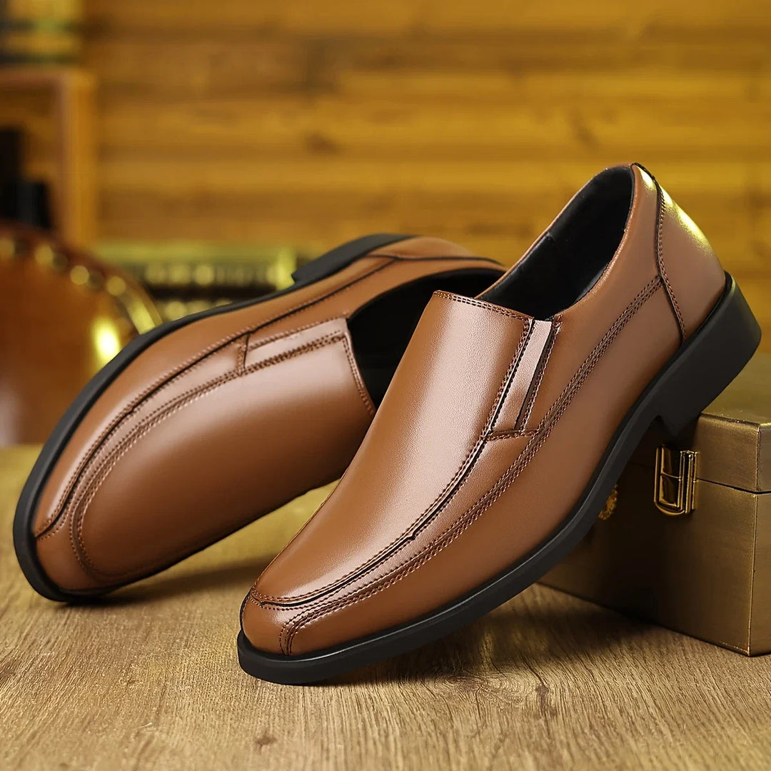 Stylish black men's Oxford loafers. Comfortable slip-on dress shoes, perfect for formal or everyday wear.