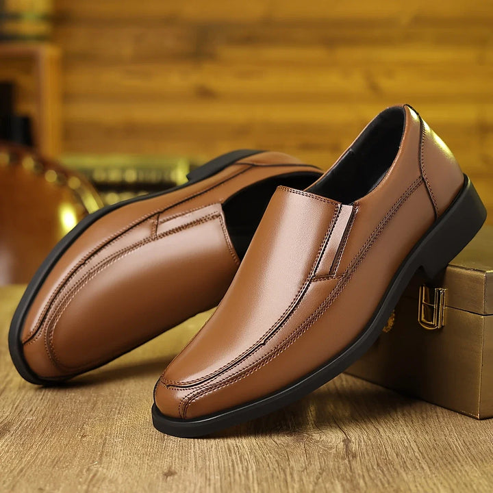 Stylish black men's Oxford loafers. Comfortable slip-on dress shoes, perfect for formal or everyday wear.
