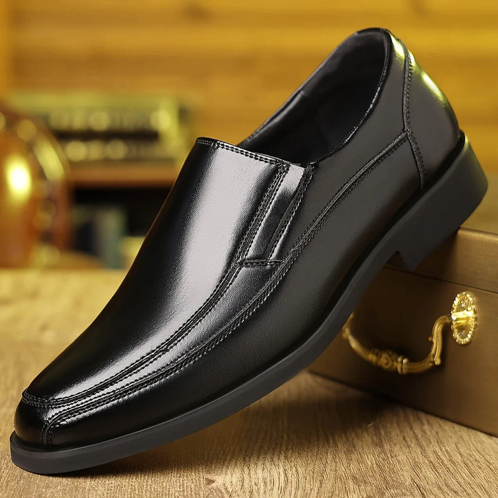 Side view of men's black Oxford loafers. Elegant slip-on design provides all-day comfort & sophisticated style.