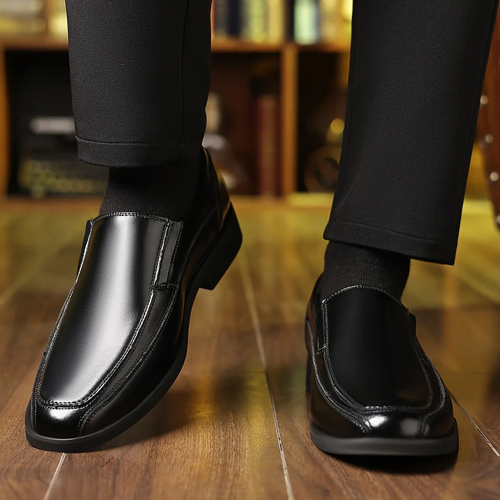 Stylish men's black Oxford loafers. Comfortable slip-on shoes, perfect for versatile dress, formal, or casual outfits.