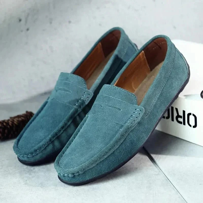 Black men's slip-on loafers, sleek & comfortable footwear for any modern man's wardrobe.