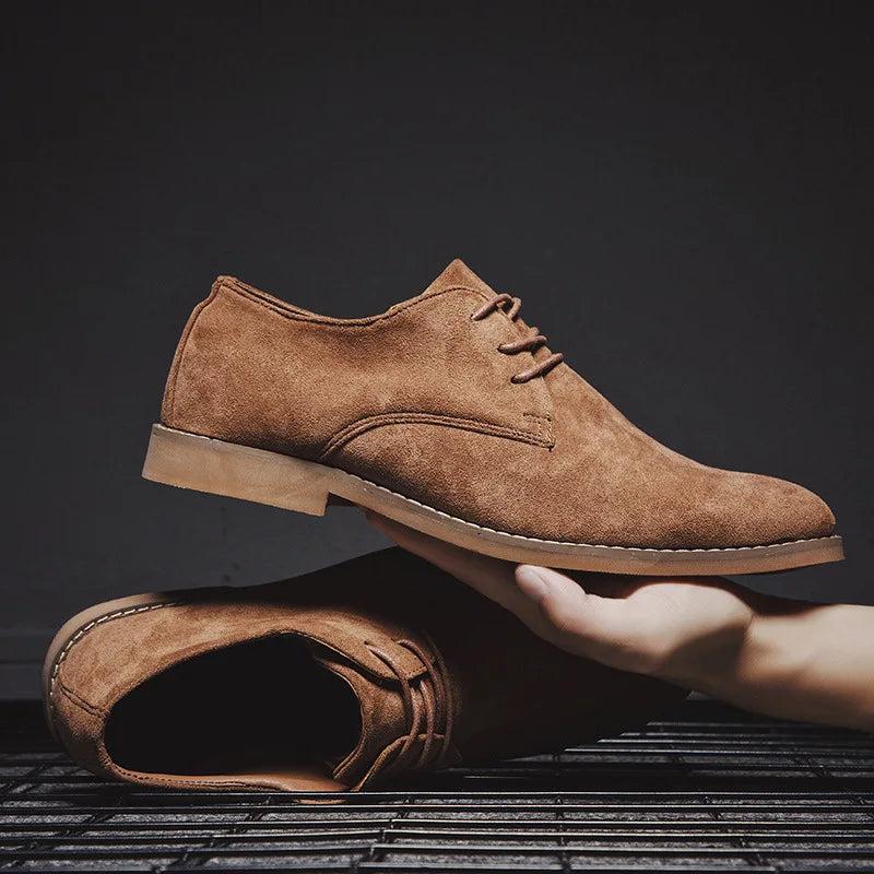 Close-up of rich brown suede texture on men's derby shoes, emphasizing material quality.