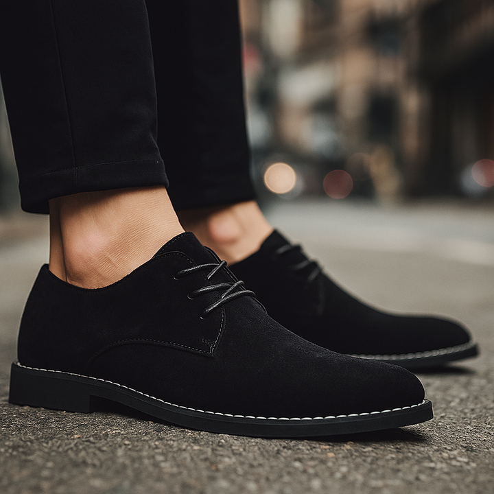Detailed view of men's lace-up suede derby shoes, showcasing high-quality craftsmanship.