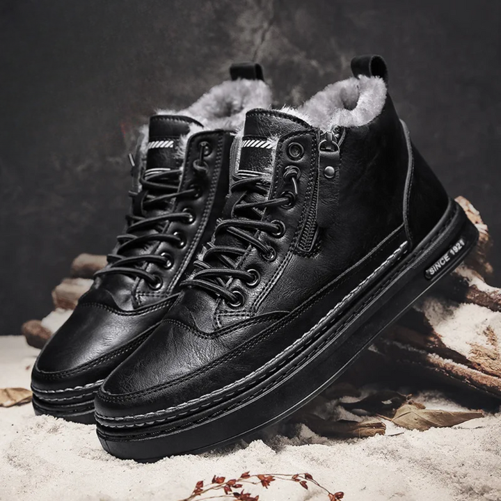 Black Bryson men's insulated leather boots, ideal winter & snow footwear. Rugged, casual, slip-resistant.