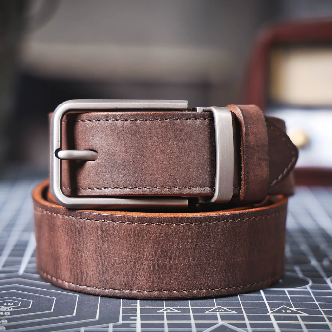 Men's durable brown full-grain leather belt, classic Buckhorn style for any outfit.