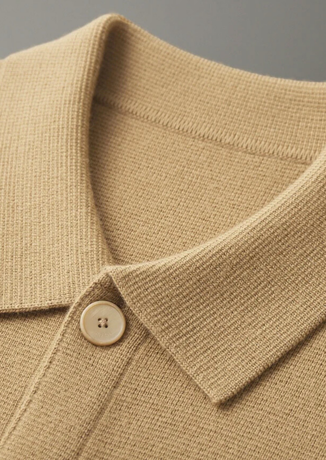 Casual yet chic men's button-up cardigan with patch pockets; essential long sleeve knitwear for layering.
