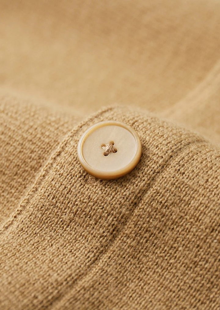Classic men's long sleeve button-up cardigan; soft knit with patch pockets, perfect for autumn layering.