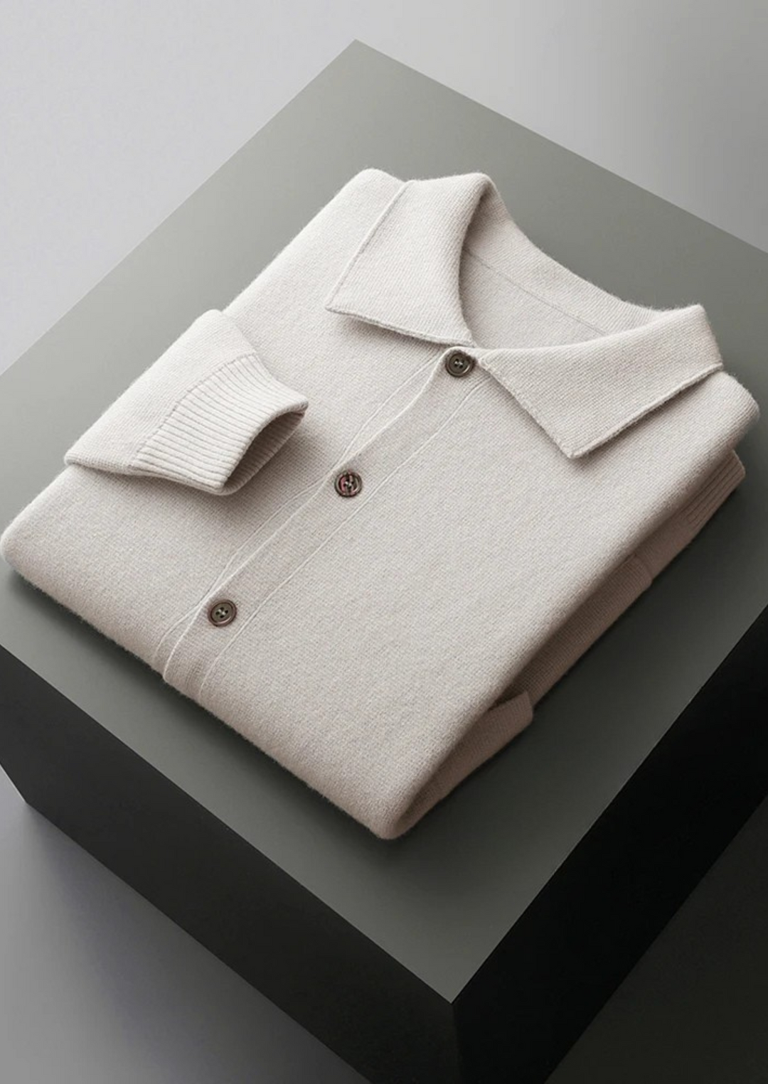 Modern men's button-up knit cardigan, featuring patch pockets; a stylish layering piece for any outfit.