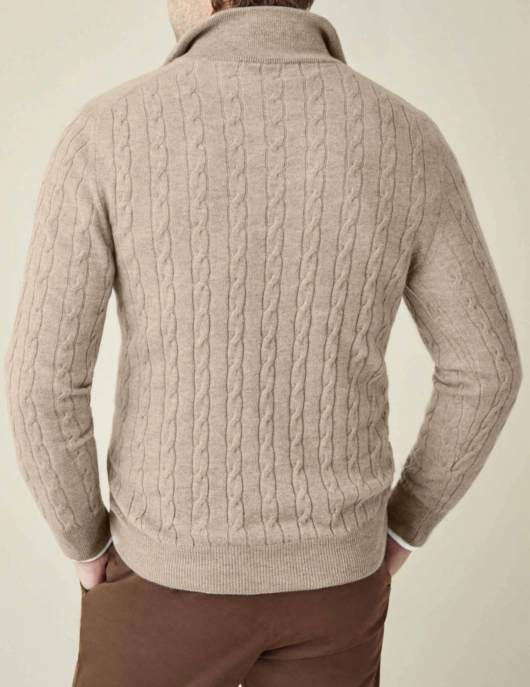 Front view of a men's long sleeve cable knit quarter-zip sweater, a classic winter wardrobe piece.