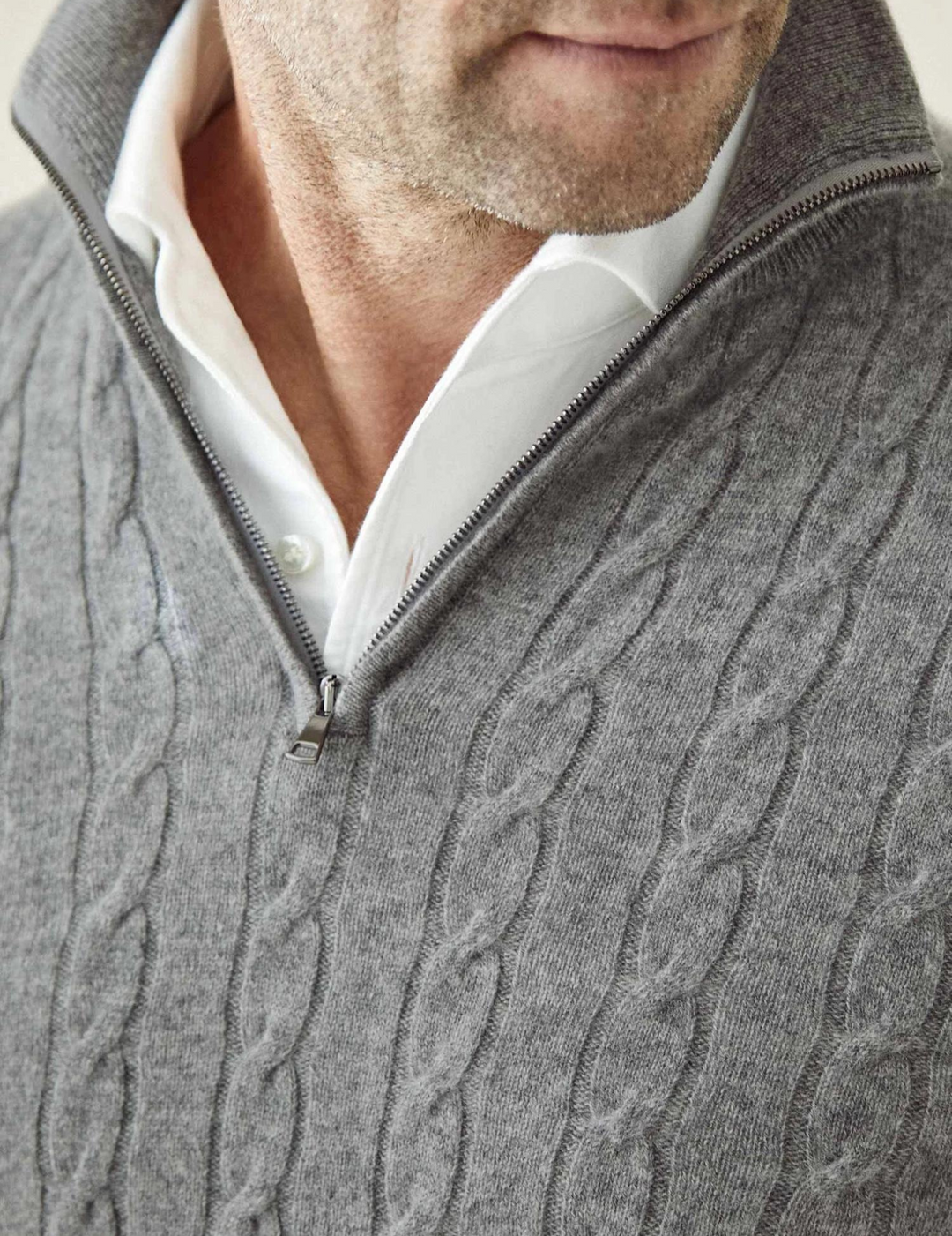 High-quality men's cable knit quarter-zip sweater, offering enduring style and cozy warmth.
