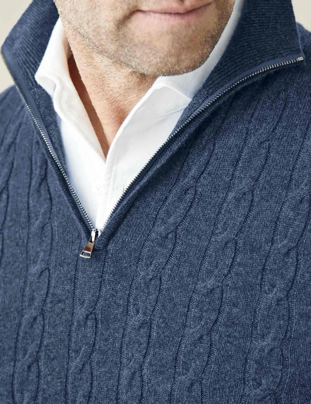 Classic men's cable knit sweater with a quarter-zip funnel neck, ideal for smart casual wear.