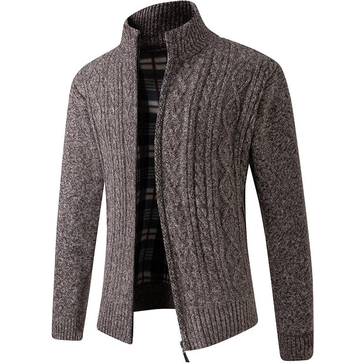 Front view of a men's full-zip cable knit cardigan, emphasizing its structured design and warmth.