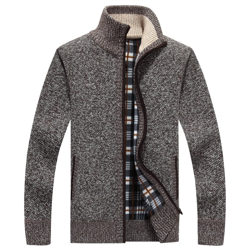 Man wearing a comfortable brown zipped cable knit cardigan, a modern and stylish men's fashion piece.