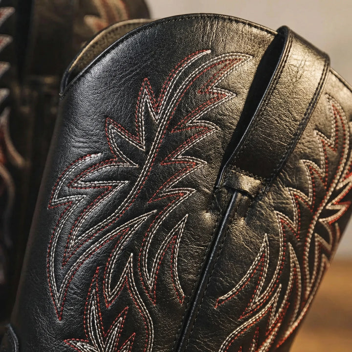 Men's rugged Western cowboy boots, calf-length design with detailed embroidery and practical block heel.