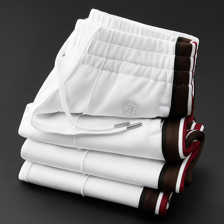 Sporty men's Callahan spliced casual pants, elastic waist for flexible, no-iron everyday style.