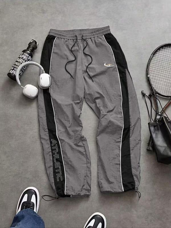 Men's Calvera athletic track pants, ideal for training & comfort. Tapered fit, activewear.