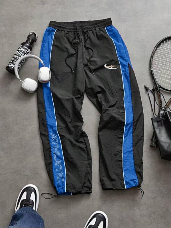 Stylish men's Calvera track pants for gym, workout, or casual wear. Comfortable tapered joggers.
