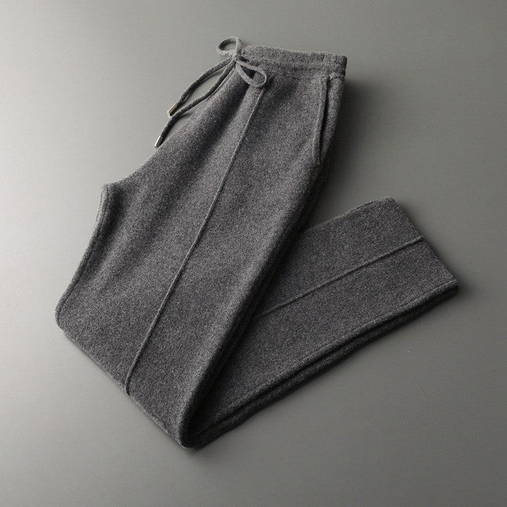 Men's relaxed fit cashmere blend lounge trousers with adjustable drawstring waist for comfort.