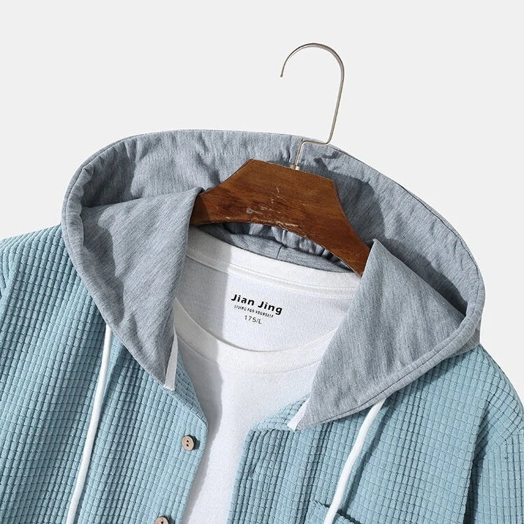 Men's casual long-sleeve hooded button-up, essential for everyday comfort and modern fall style.