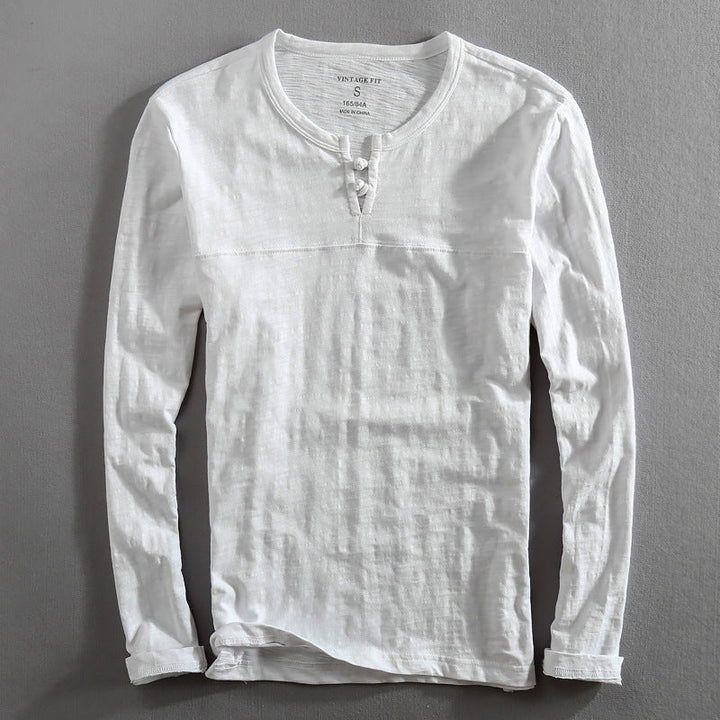 Comfortable men's white long-sleeve henley. Soft everyday top for casual style and versatility.
