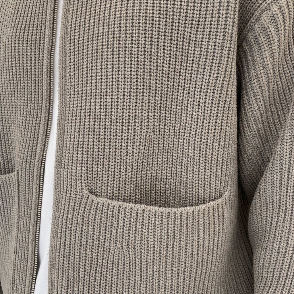 Stylish man wearing a modern gray knit cardigan sweater, perfect for fall fashion