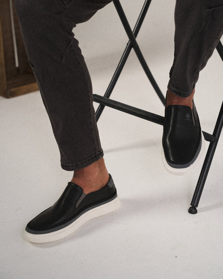 Premium brown leather men's slip-on shoes, offering comfort and durability.