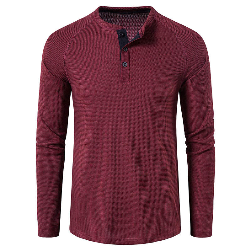 Close-up of men's casual henley shirt fabric and button placket, emphasizing comfort & quality details.