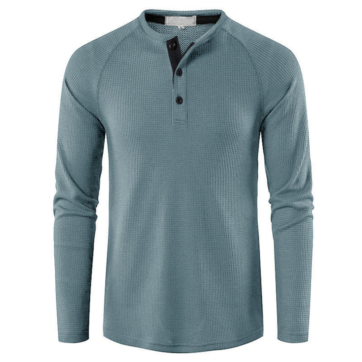 Relaxed fit men's long sleeve henley shirt for comfortable, stylish casual wear. Essential everyday fashion.