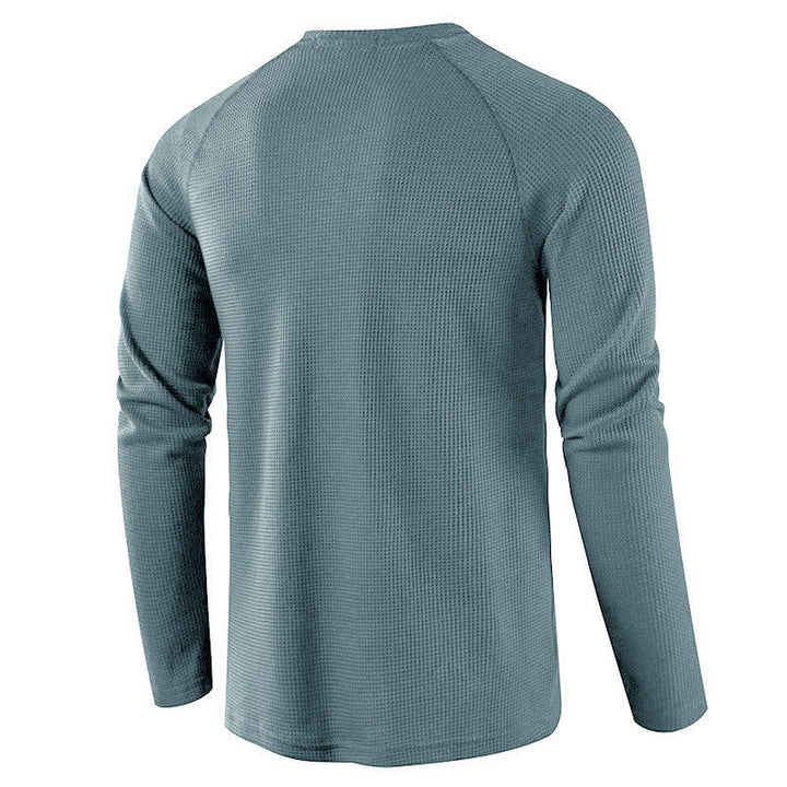 Minimalist men's long sleeve henley shirt, a comfortable and stylish choice for versatile casual wear.