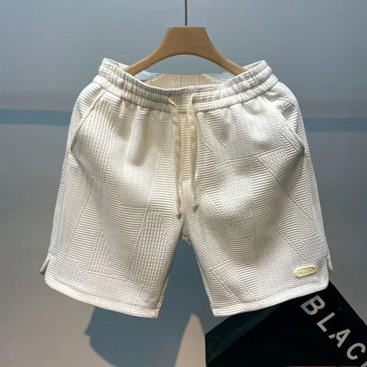 Athletic men's breathable shorts in a neutral color, showcasing the quick-dry fabric for active lifestyles