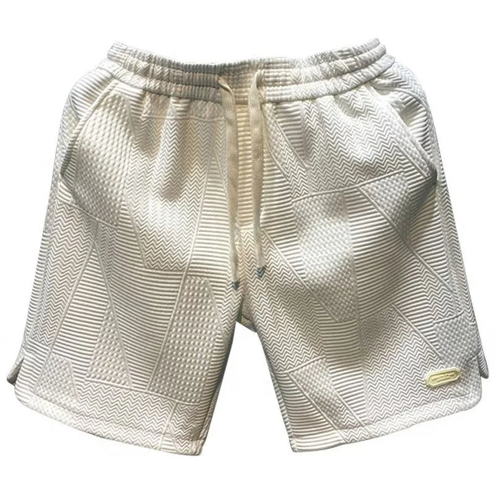 Close-up of the quick-dry fabric texture on men's casual shorts, highlighting breathability and durability