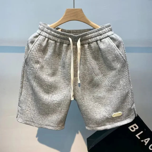 Dynamic shot of men's quick-dry shorts in grey, perfect for summer wear, cycling, or casual outings