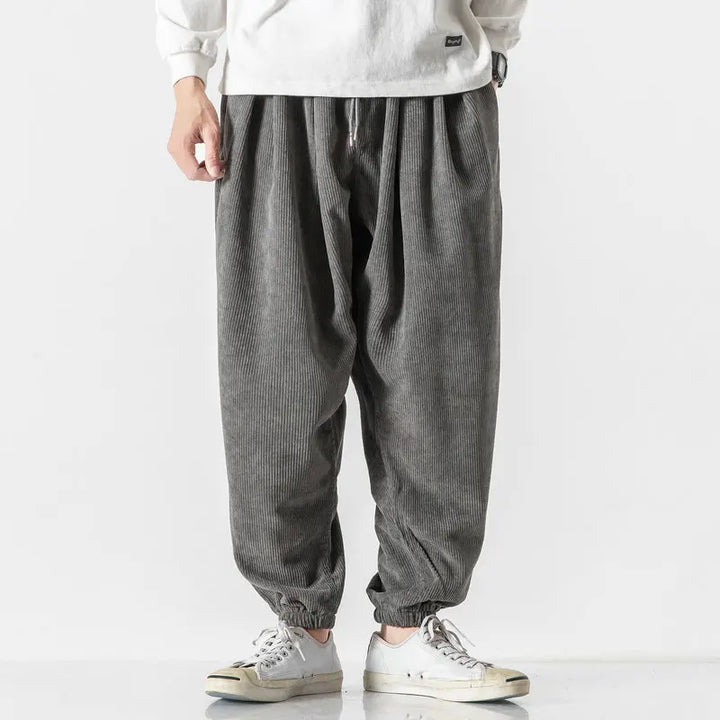 Stylish men's casual corduroy pants, featuring a wide leg and comfortable drawstring for daily wear.