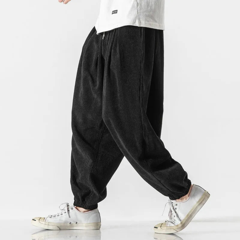 Full view of men's wide leg corduroy pants in a relaxed fit, great for versatile casual styling.