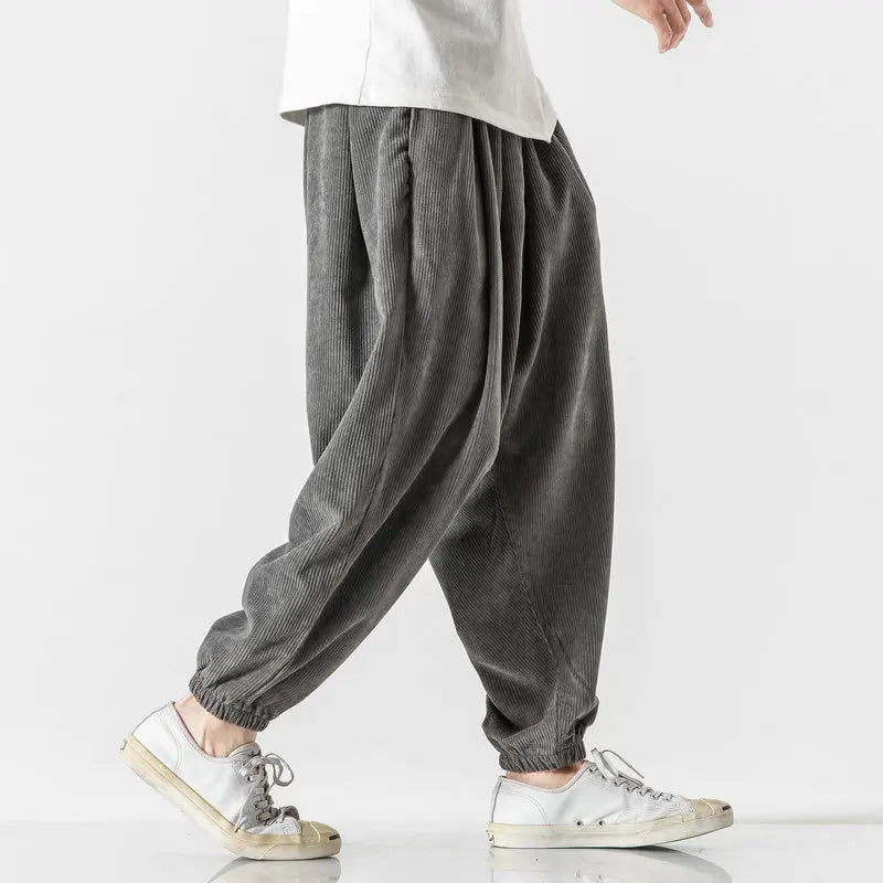Textured men's corduroy pants, relaxed fit with comfortable drawstring; a fall & winter fashion staple.