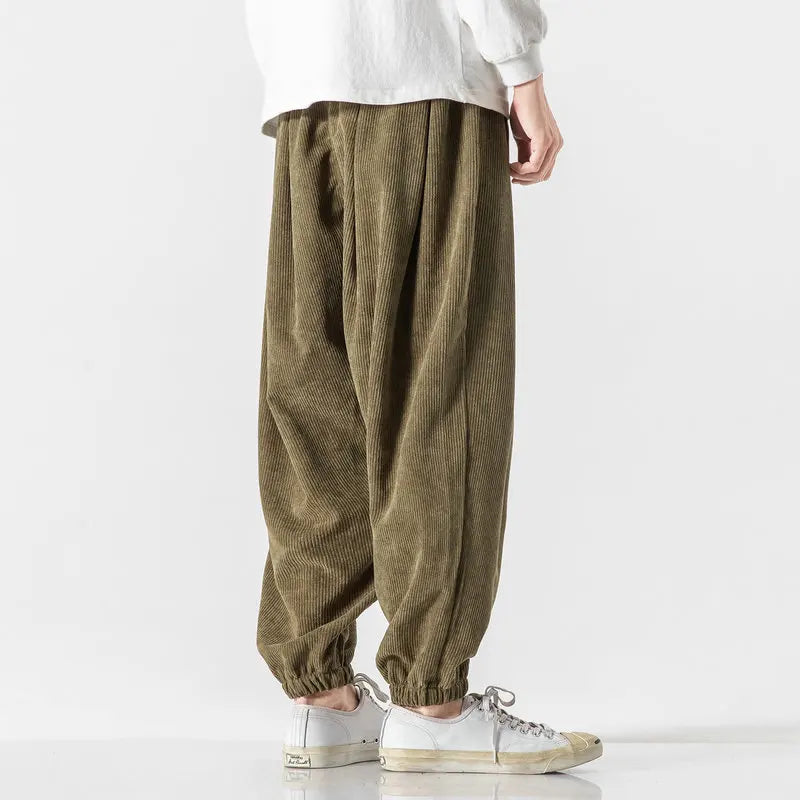 Men's casual corduroy pants, wide leg & relaxed fit, styled for comfortable street wear.