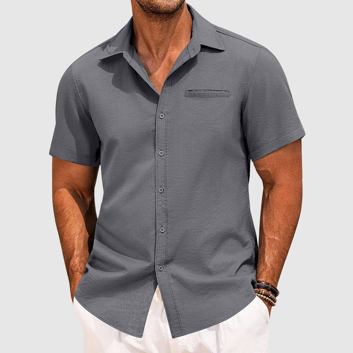 Versatile men's button-down summer shirt. Short sleeve, casual style with a chest pocket for modern fashion.
