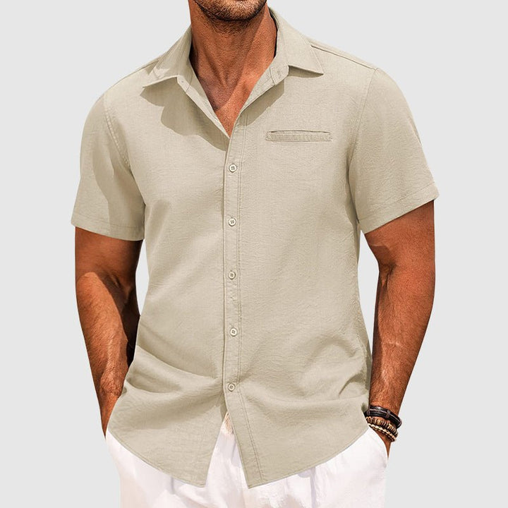 Men's button-down short sleeve summer shirt, showing a comfortable, modern fit with subtle design and chest pocket.