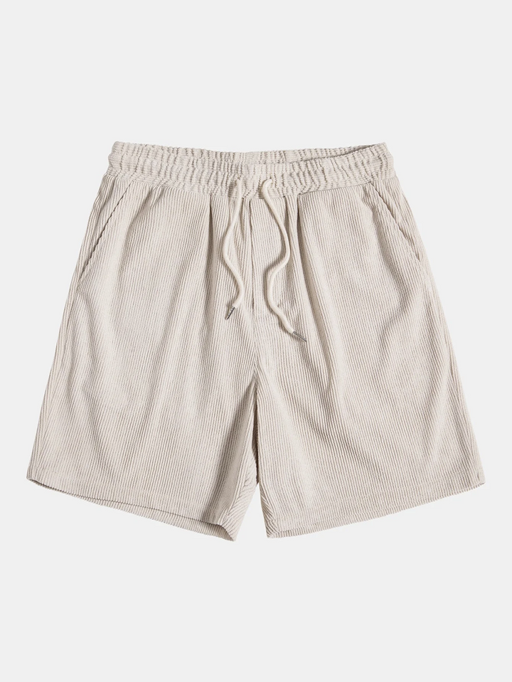Close-up of the fabric texture on a men's corduroy shorts and matching summer shirt set