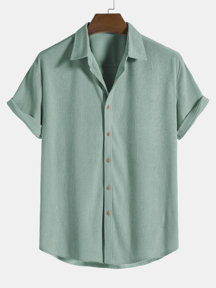 Detail of the men's casual short sleeve shirt from a summer two-piece outfit with corduroy shorts