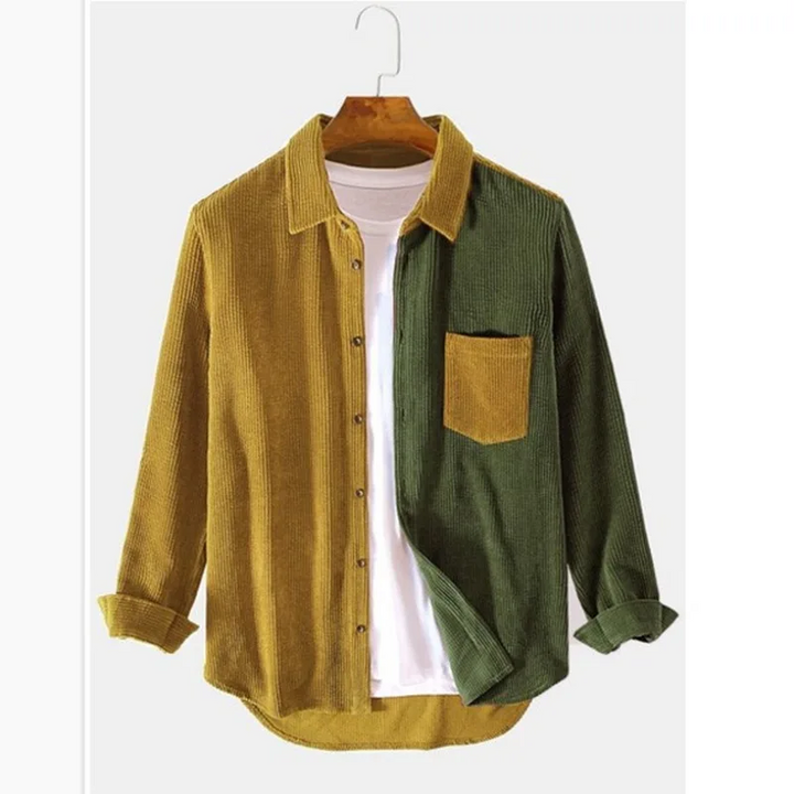 Man wearing a relaxed fit men's splice color block button-up shirt, styled open as a layering piece. Casual & versatile.