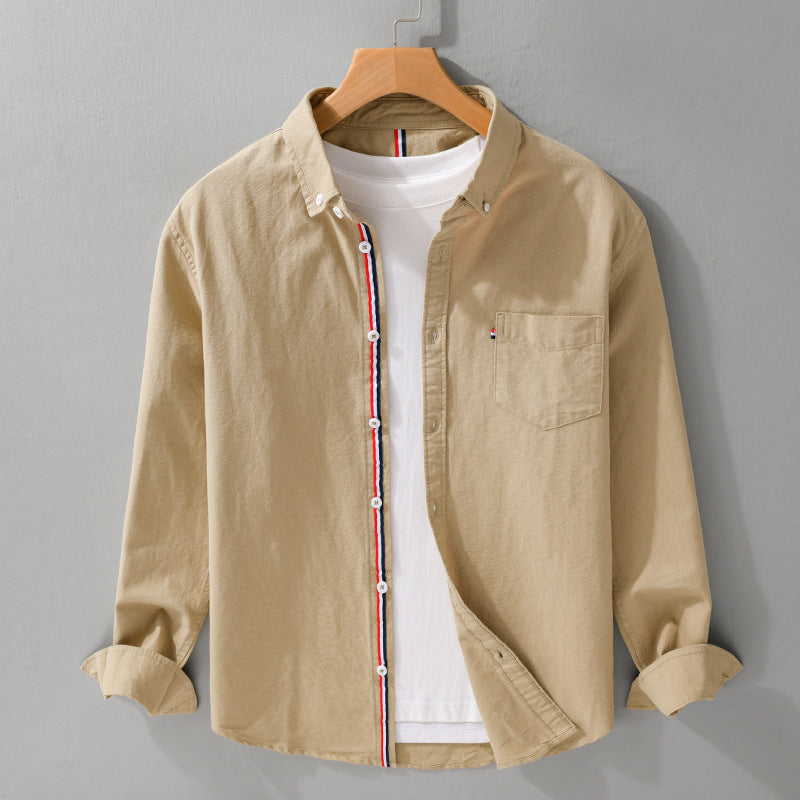 Modern men's long-sleeve striped button-up shirt, comfortable and stylish. Great for casual menswear fashion.